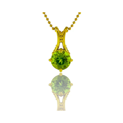 A necklace with a green stone on a gold chain
