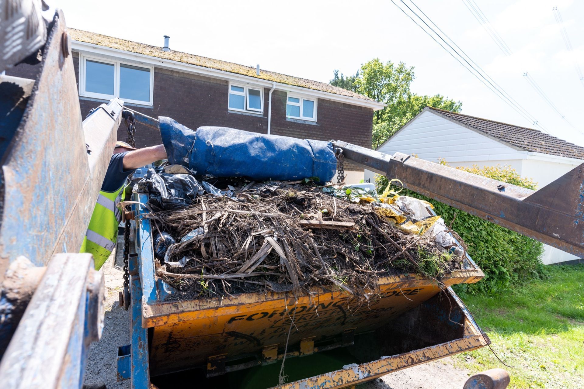 rf recycling skip full and just being covered ready for collection 