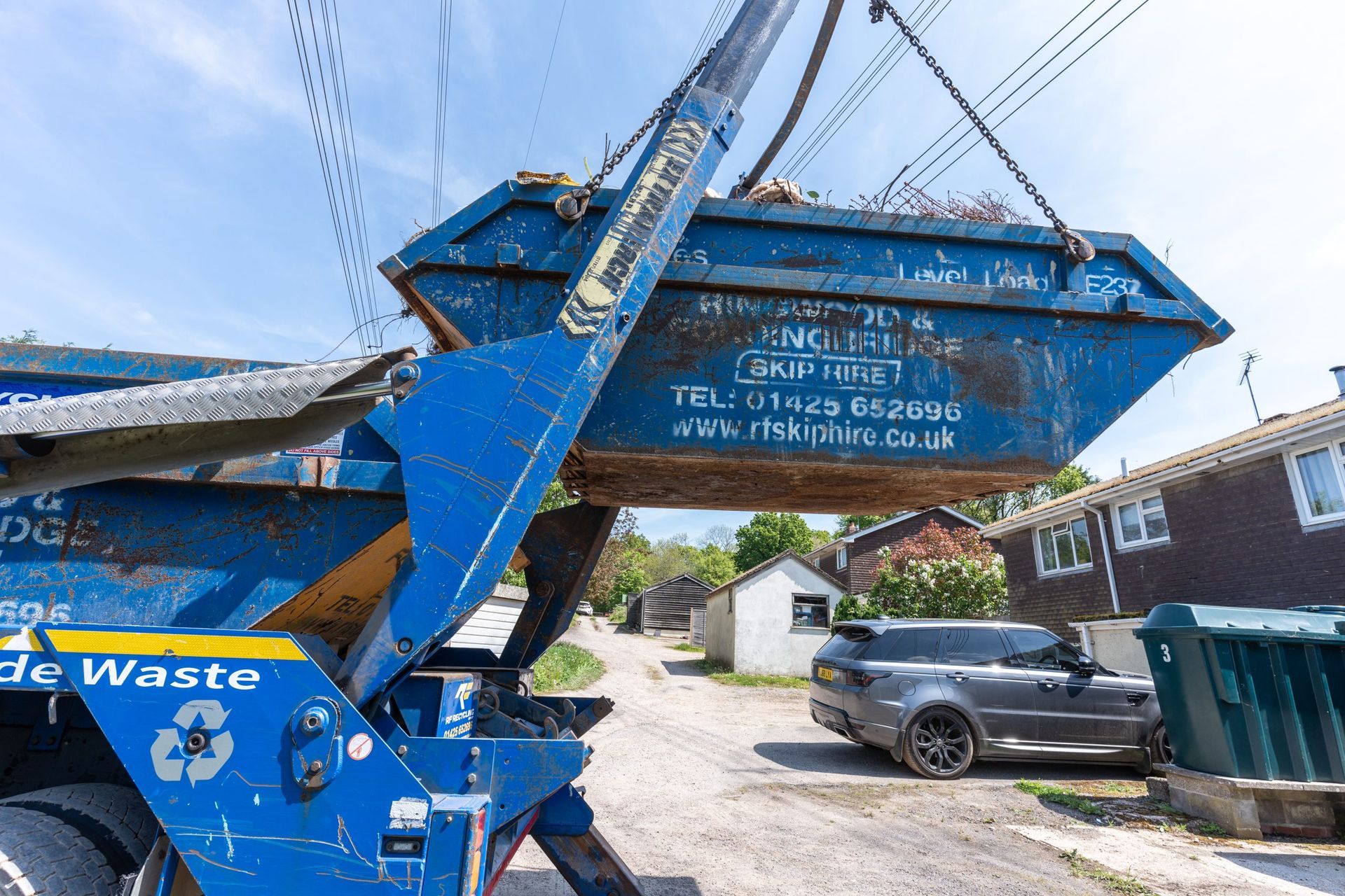 rf recycling unloading a skip at a domestic setting