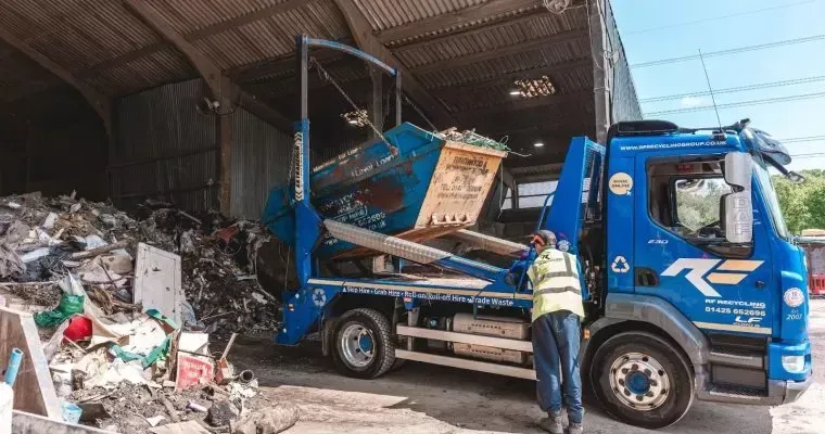 rf recycling lorry tipping a skip at the recycling centre