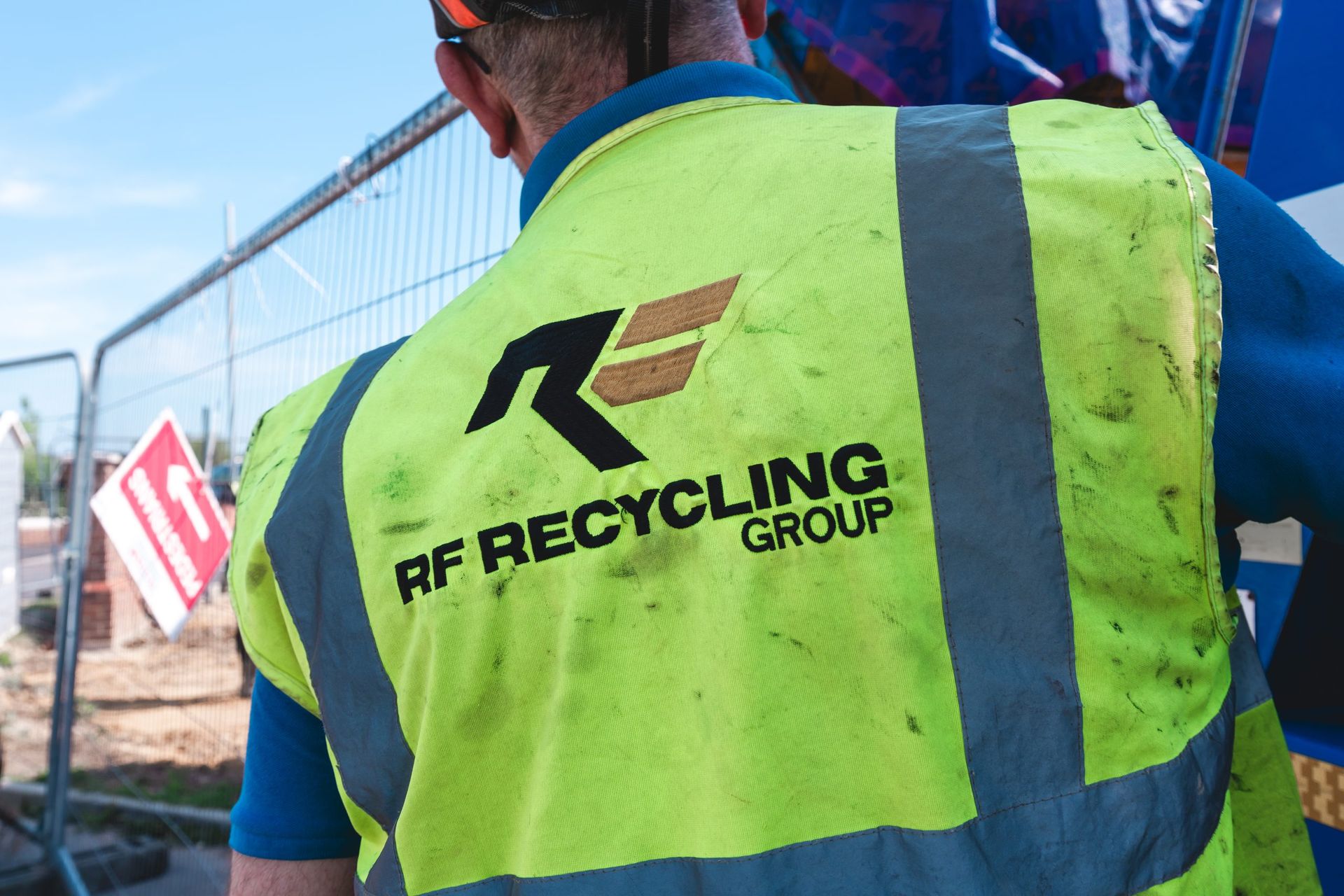 rf recycling logo on hiigh vis shirt
