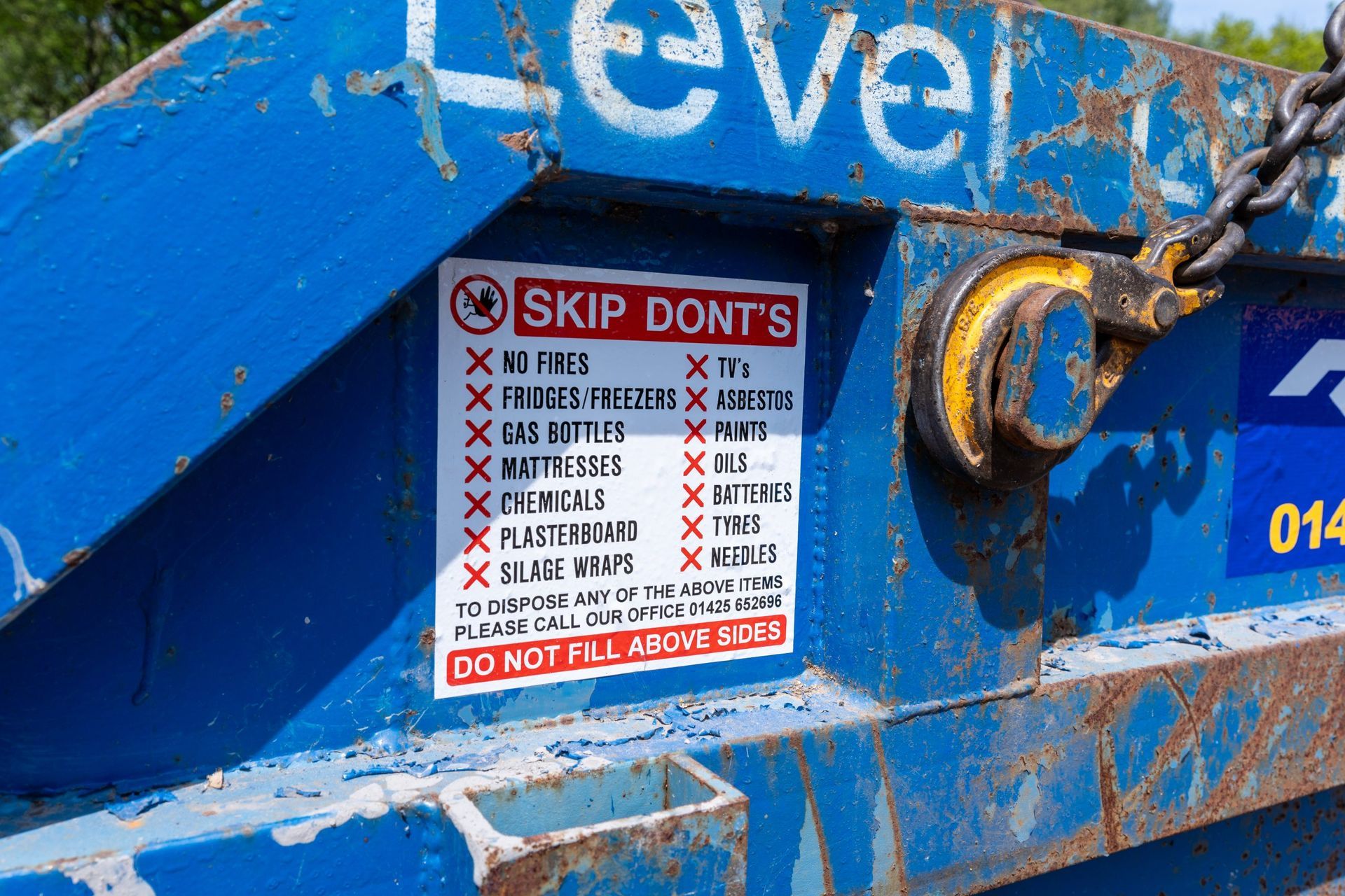 rf recycling skip with skip dont's sticker on side 
