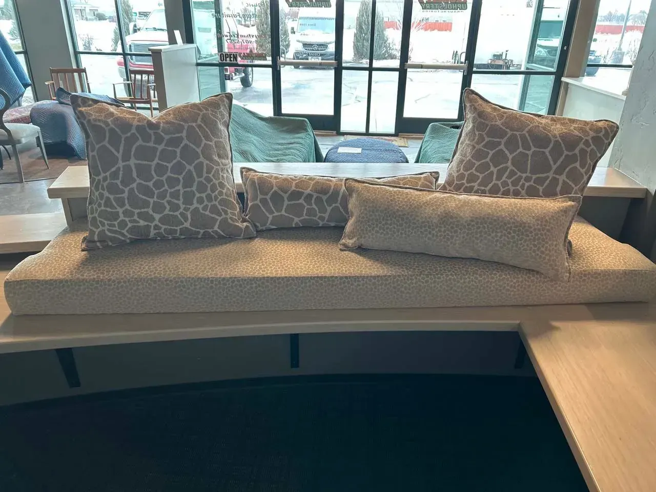 A couch with a lot of pillows on it