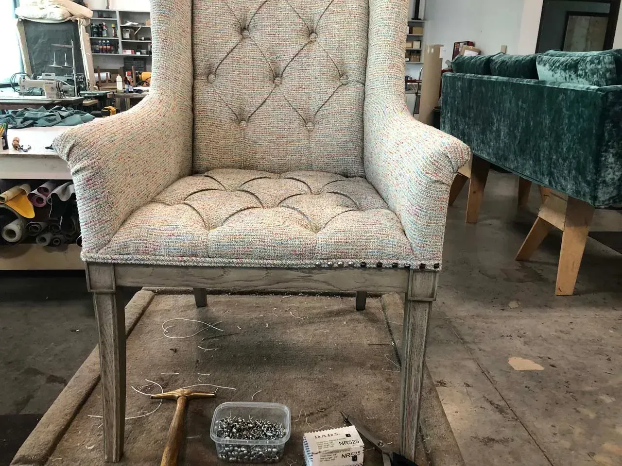 A chair is sitting on top of a wooden table in a room.