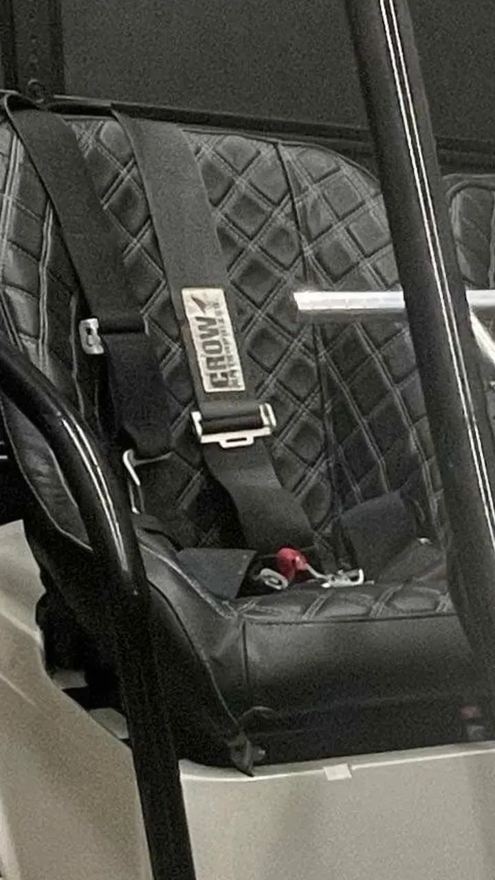 A close up of a seat belt on a vehicle.