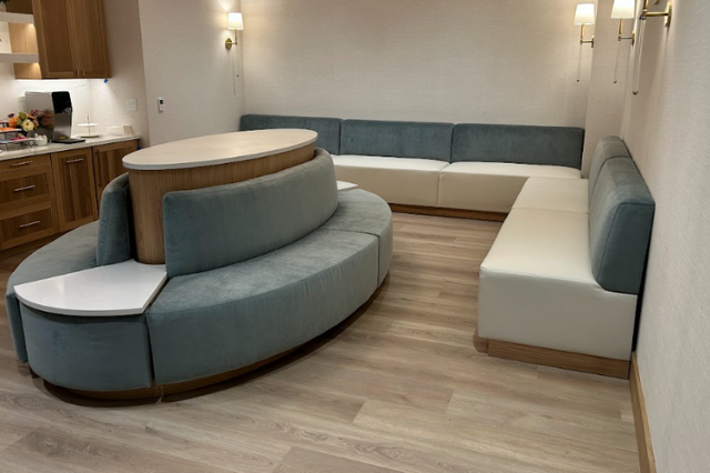 A room with a couch and a table in it