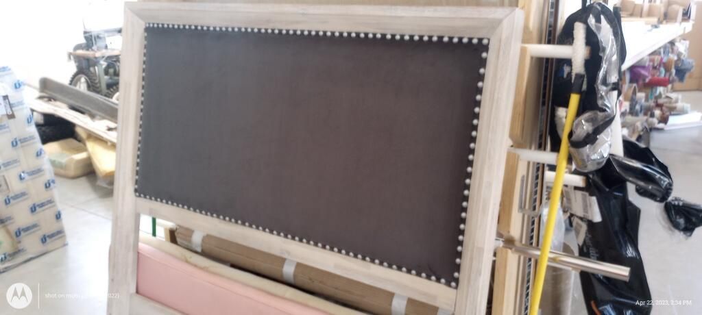 A chalkboard is sitting on top of a wooden table in a room.