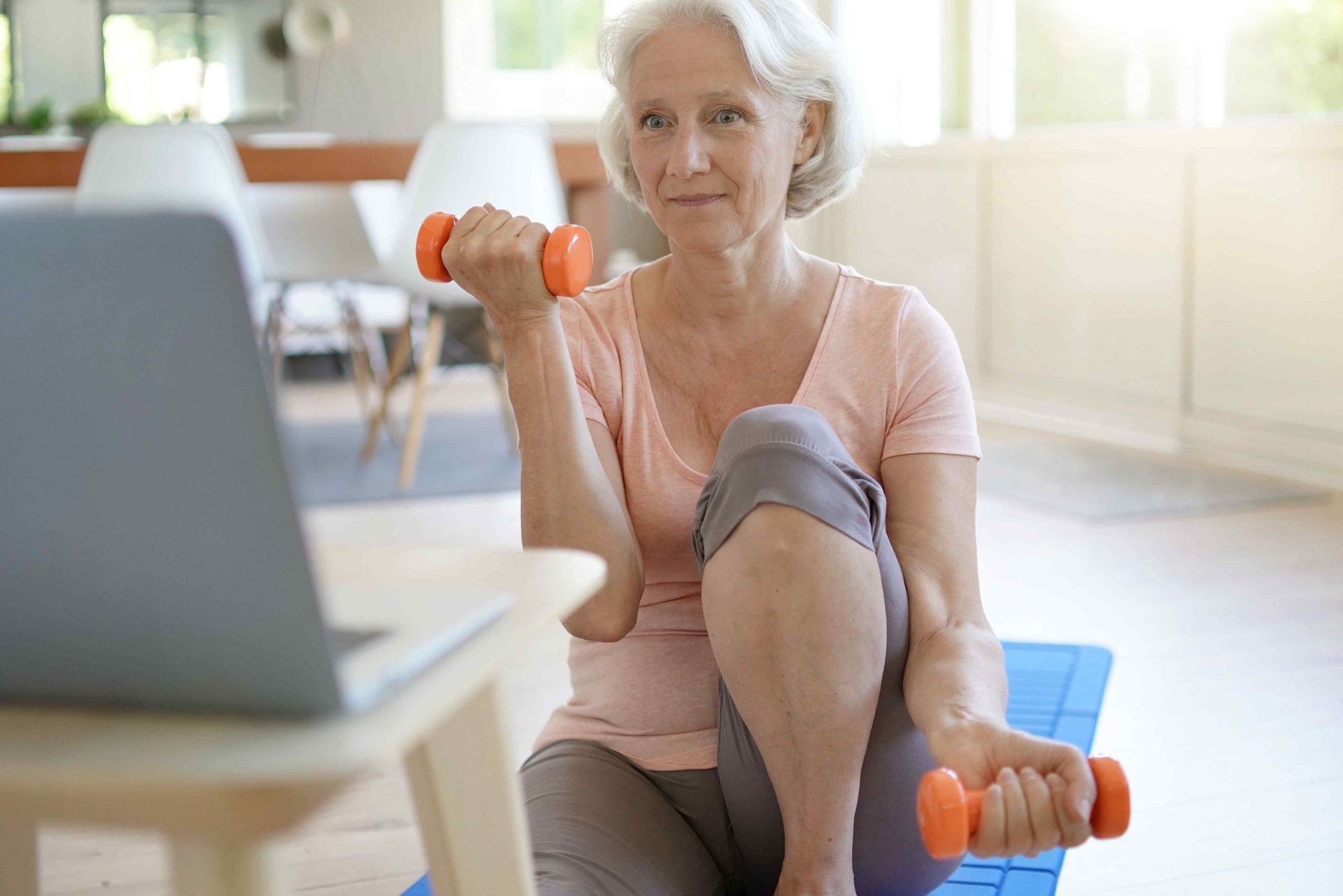 Older-woman-workout-with-weights-at-home