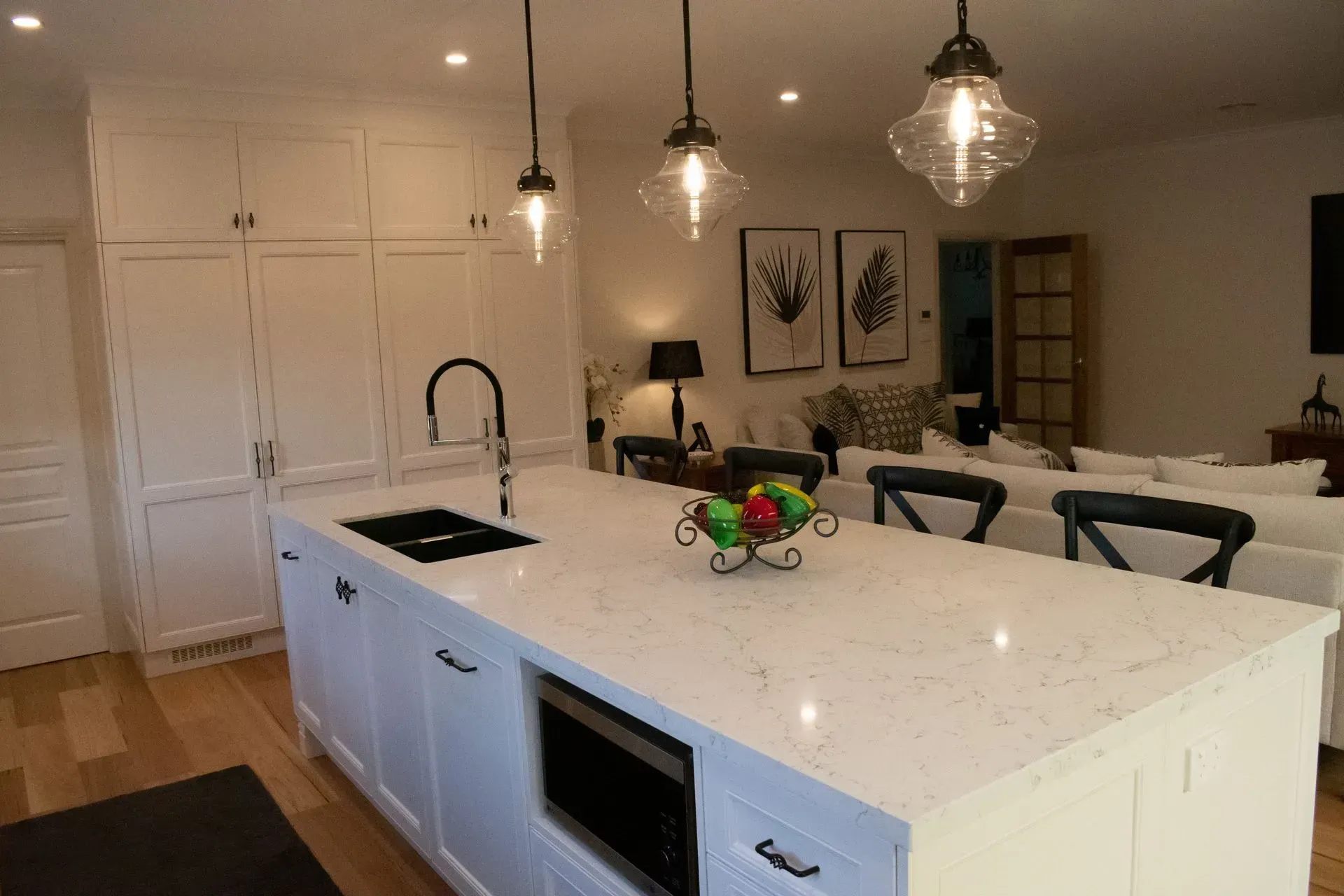 A kitchen with a large island in the middle of the room.