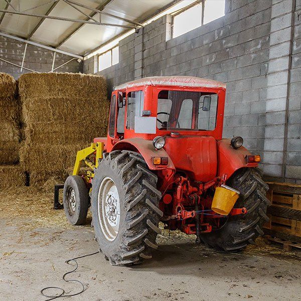 Tractor in a Shed — Tractor Tyres in Central West, NSW