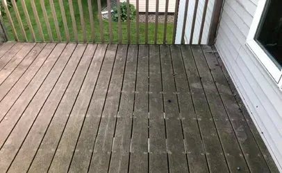 A Wooden Deck With A Fence And A Window In Front Of A House — Johns Island, SC — SoftWash Doctors