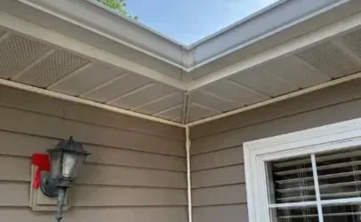 The Roof Of A House With A Gutter And A Window — Johns Island, SC — SoftWash Doctors