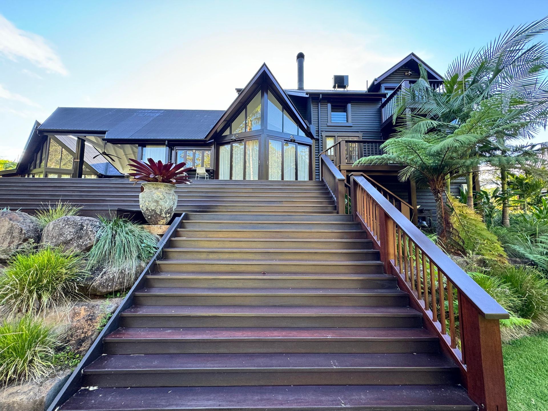 Skilled Artisan Painting Woodwork Outdoors — Professional Painters in Suffolk Park, NSW