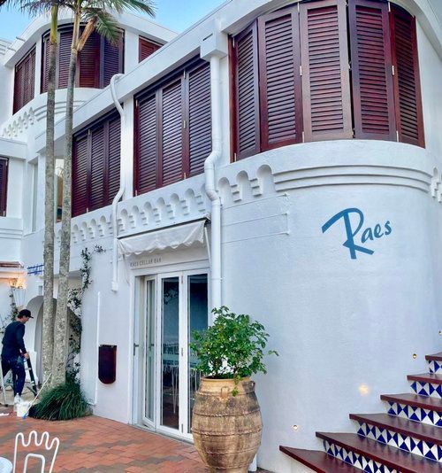 A White building With A Sign That Says 'Raes' On It — Professional Painters in Suffolk Park, NSW
