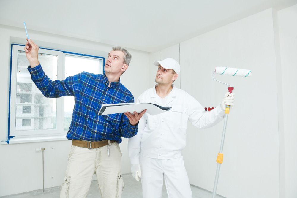 A Man Worker And Painter Worker Discussing Painting Walls In Room — Professional Painters in Bangalow, NSW