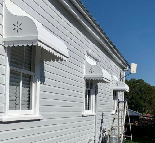 A White House With A White Awning On The Windows — Professional Painters in Suffolk Park, NSW