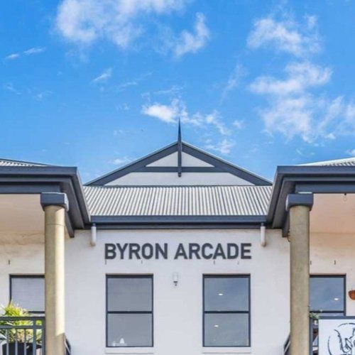 The Front Of A Building With A Sign That Says “Byron Arcade” — Professional Painters in Suffolk Park, NSW