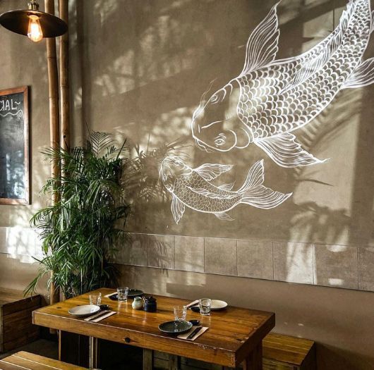 A Restaurant With A Mural Of Two Fish On The Wall — Professional Painters in Suffolk Park, NSW