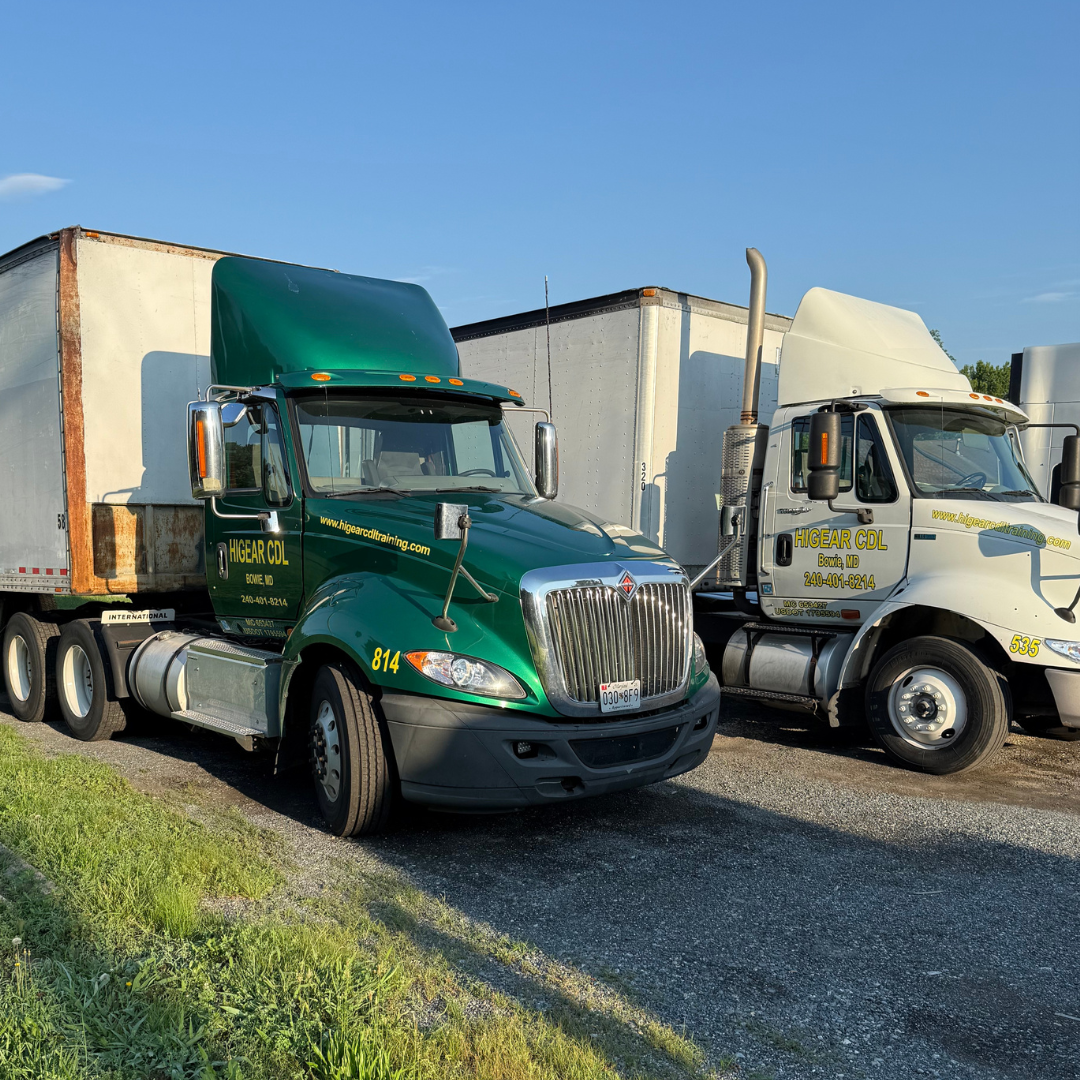 A white semi truck is parked on the side of the road.