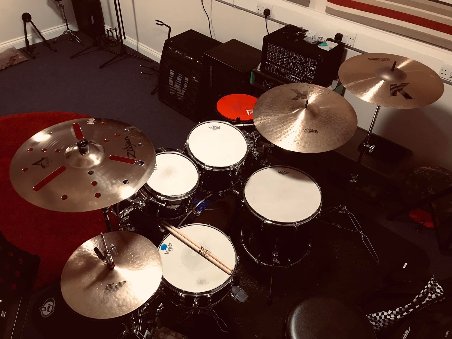 A drum set is sitting on a table in a room.