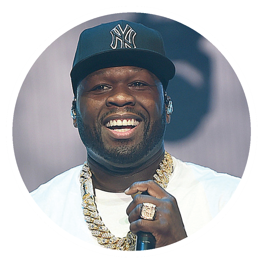 50 Cent smiling, wearing a Yankees cap, holding a microphone, and gold jewelry.