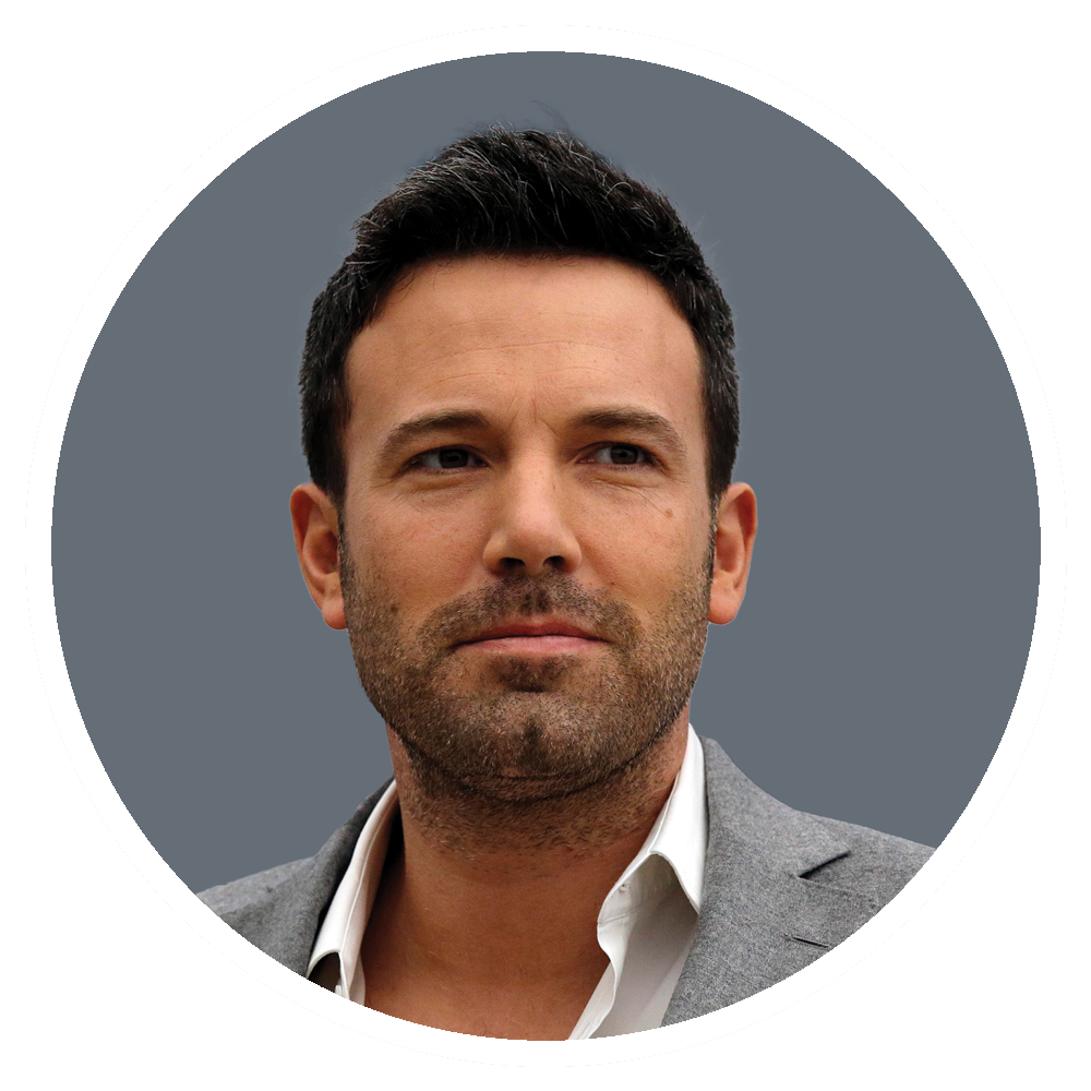 Ben Affleck in a gray suit jacket and open-collared white shirt, serious expression, against a gray background.