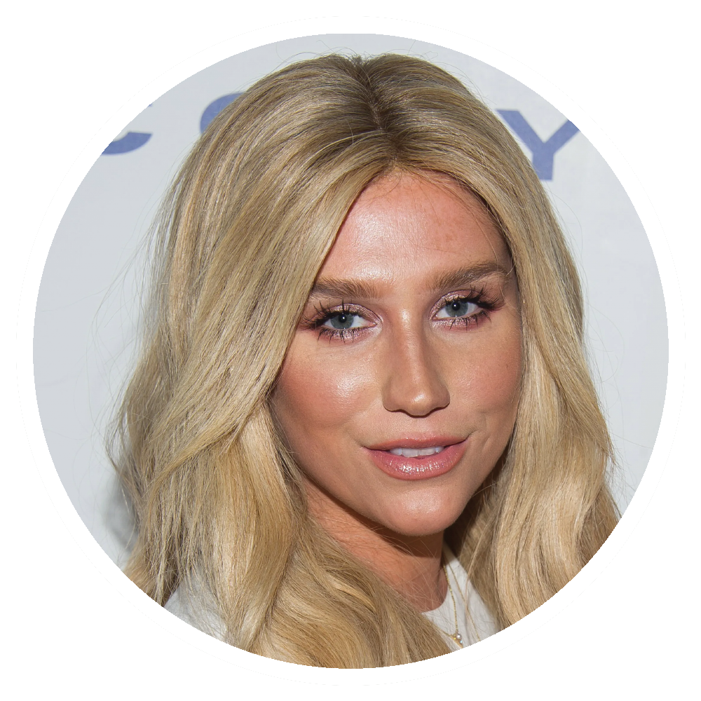  Kesha poses for a photograph, light makeup, neutral expression.