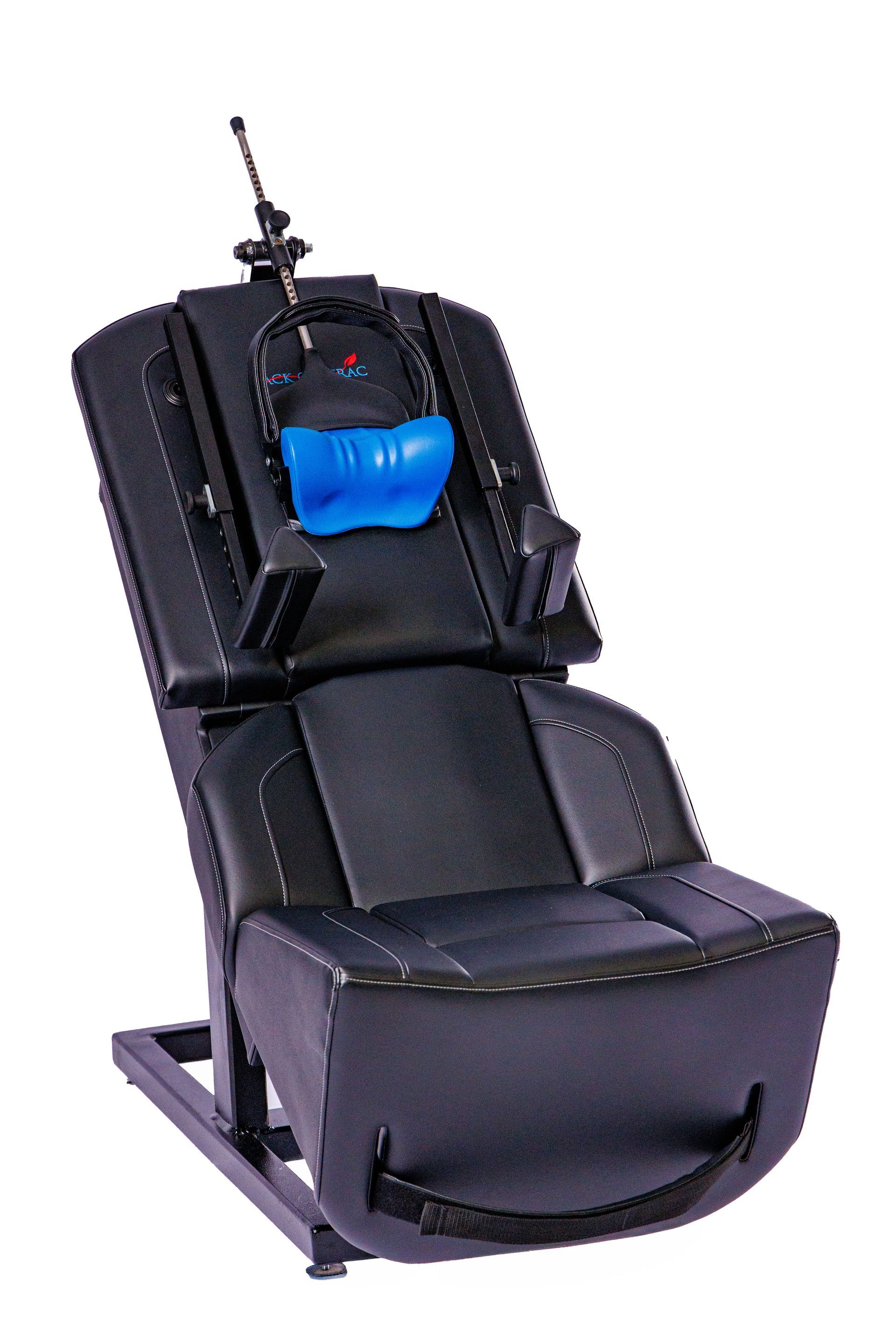A black chair with a blue pillow on the back