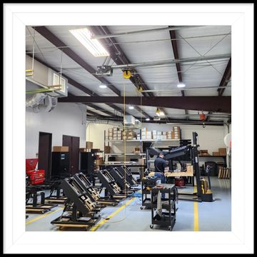 A man is working on a machine in a factory