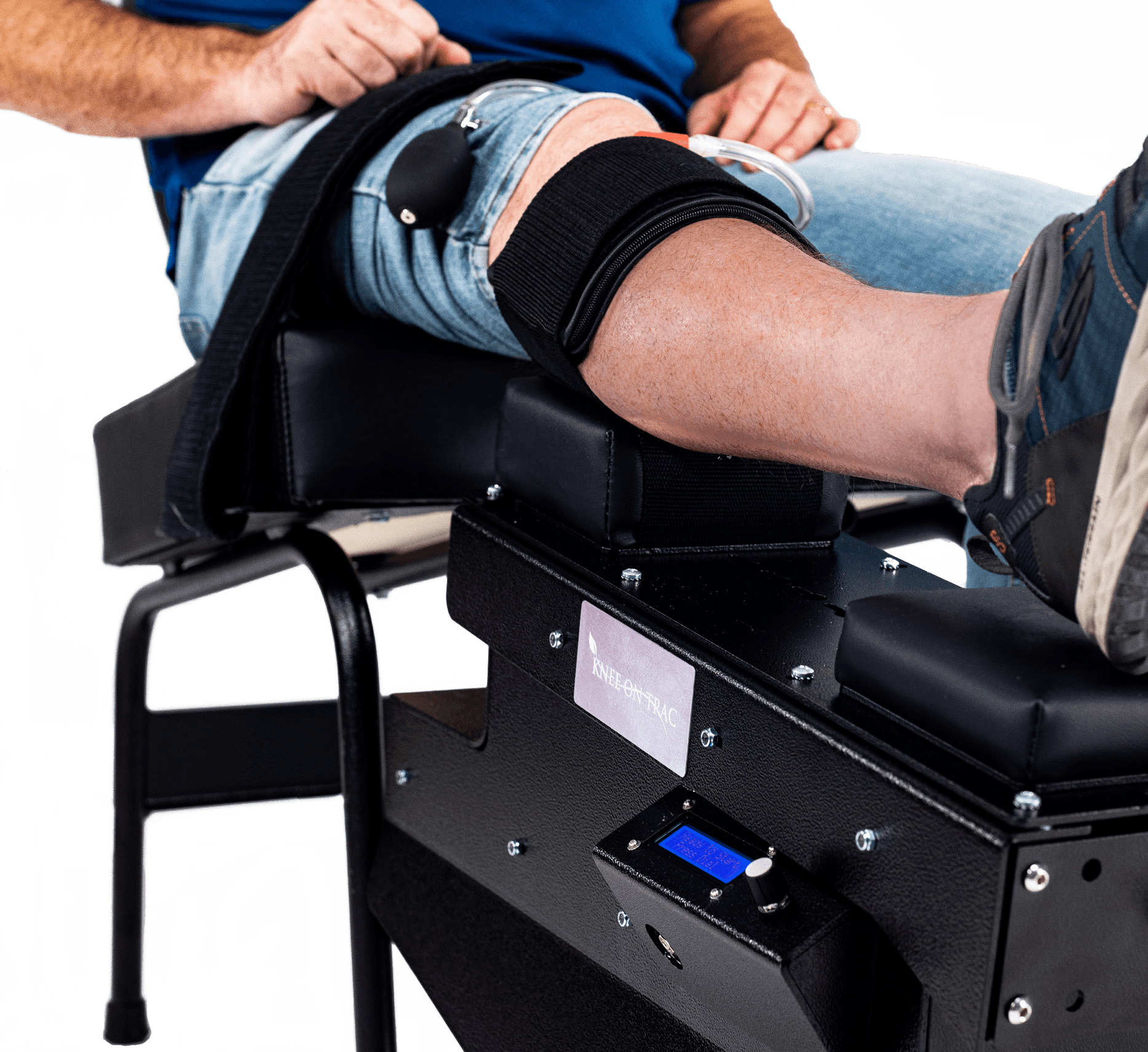 man using knee on trac system