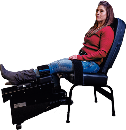 A woman is sitting in a chair with her legs crossed.