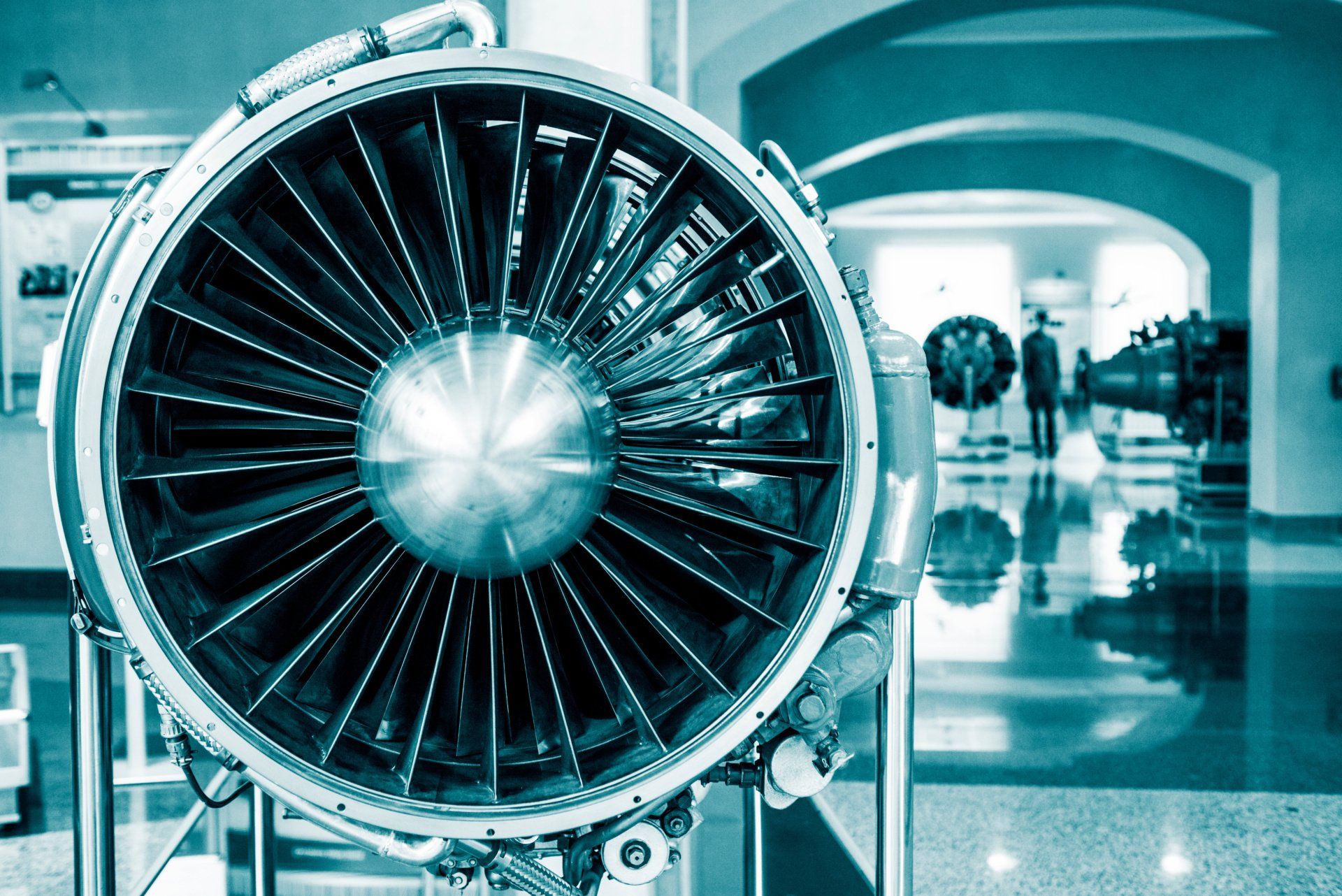 a close up of an airplane engine on display in a room .
