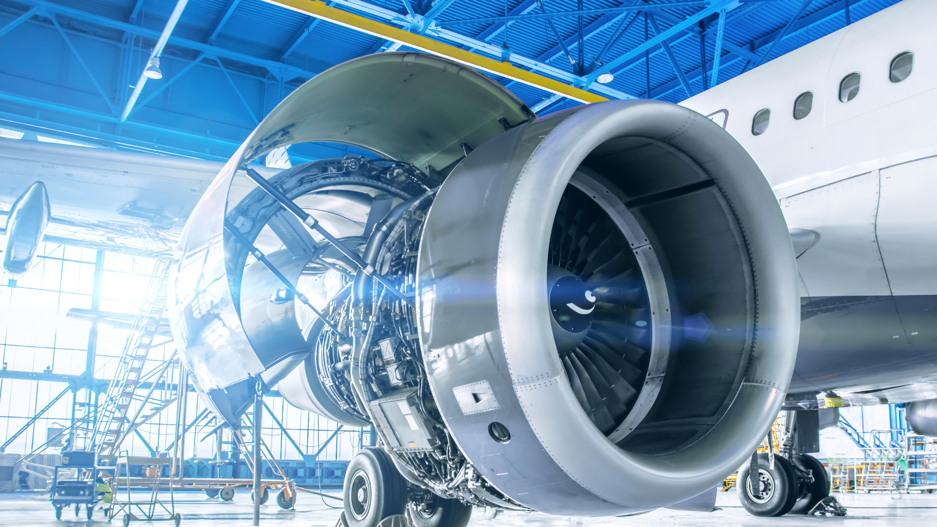 a close up of an airplane engine in a hangar .