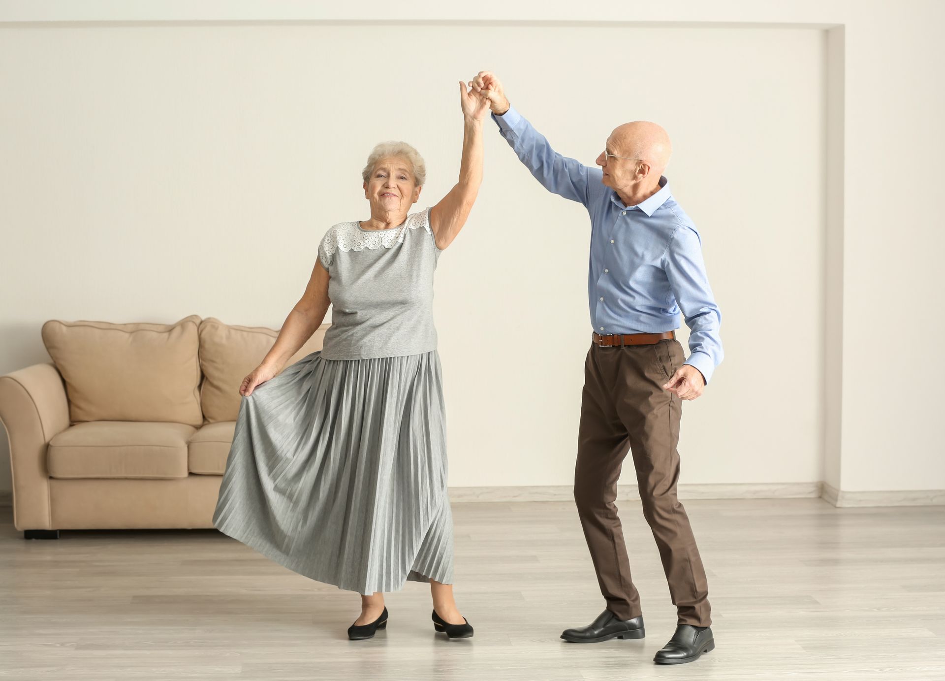 Happy couple enjoying the health benefits of dance.