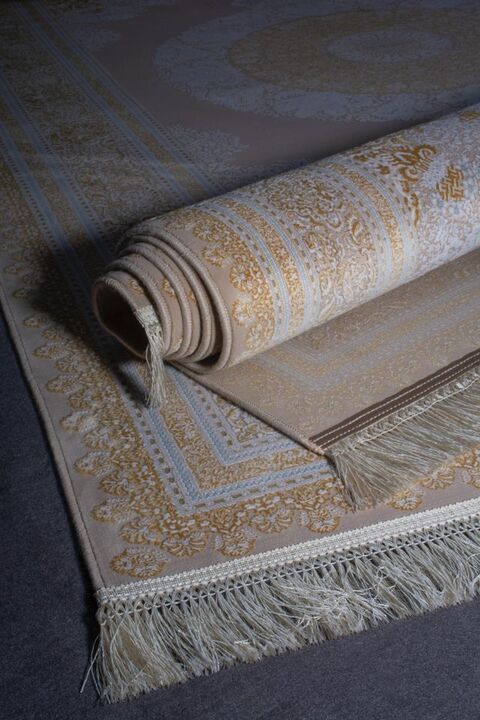 A close up of a rug rolled up on a table.