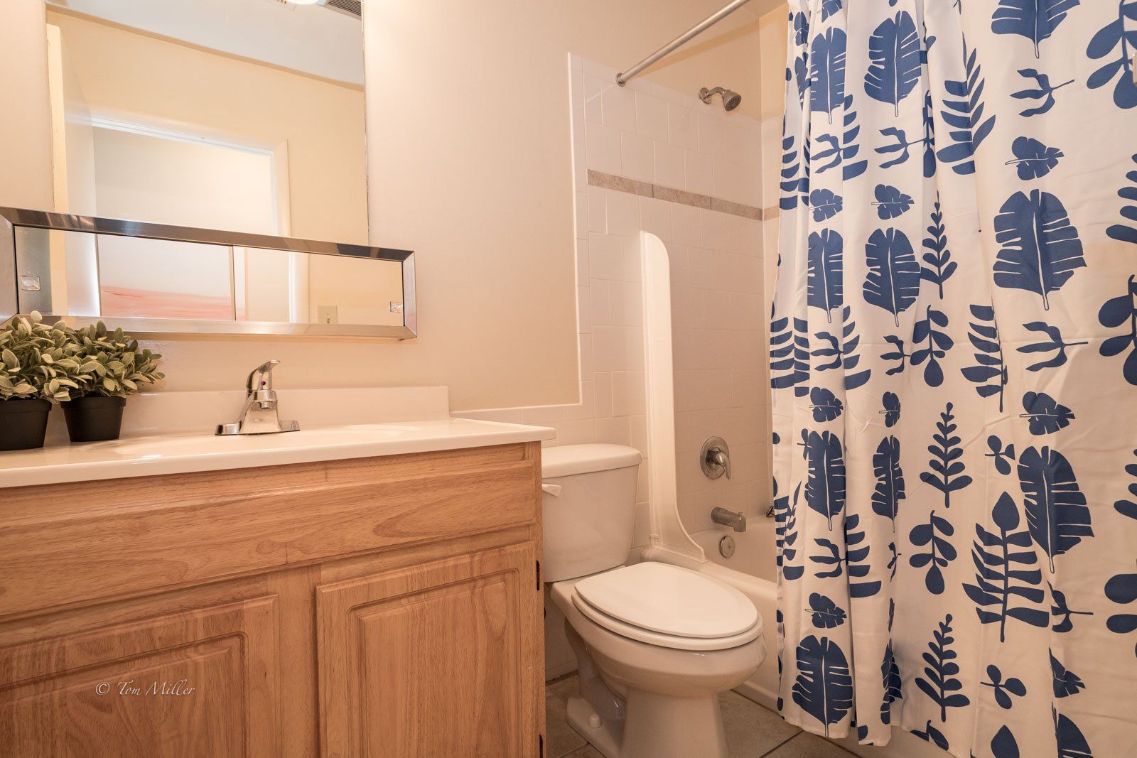 The bathroom with tropical shower curtain