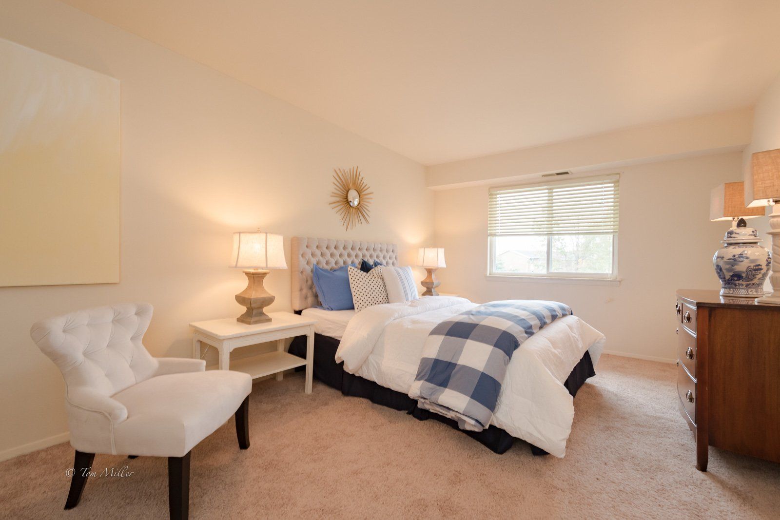 Master bedroom with dresser and chair