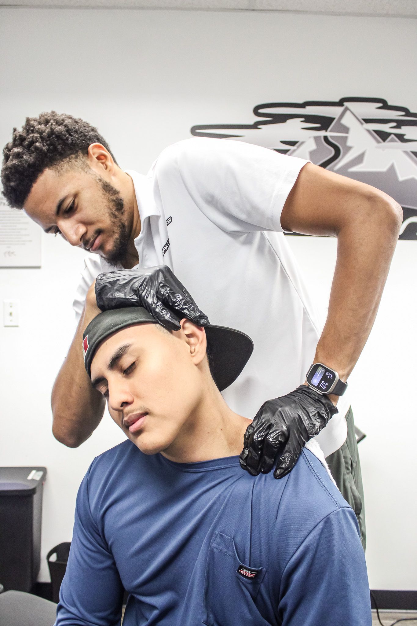 A woman is getting a massage on her back in a spa.
