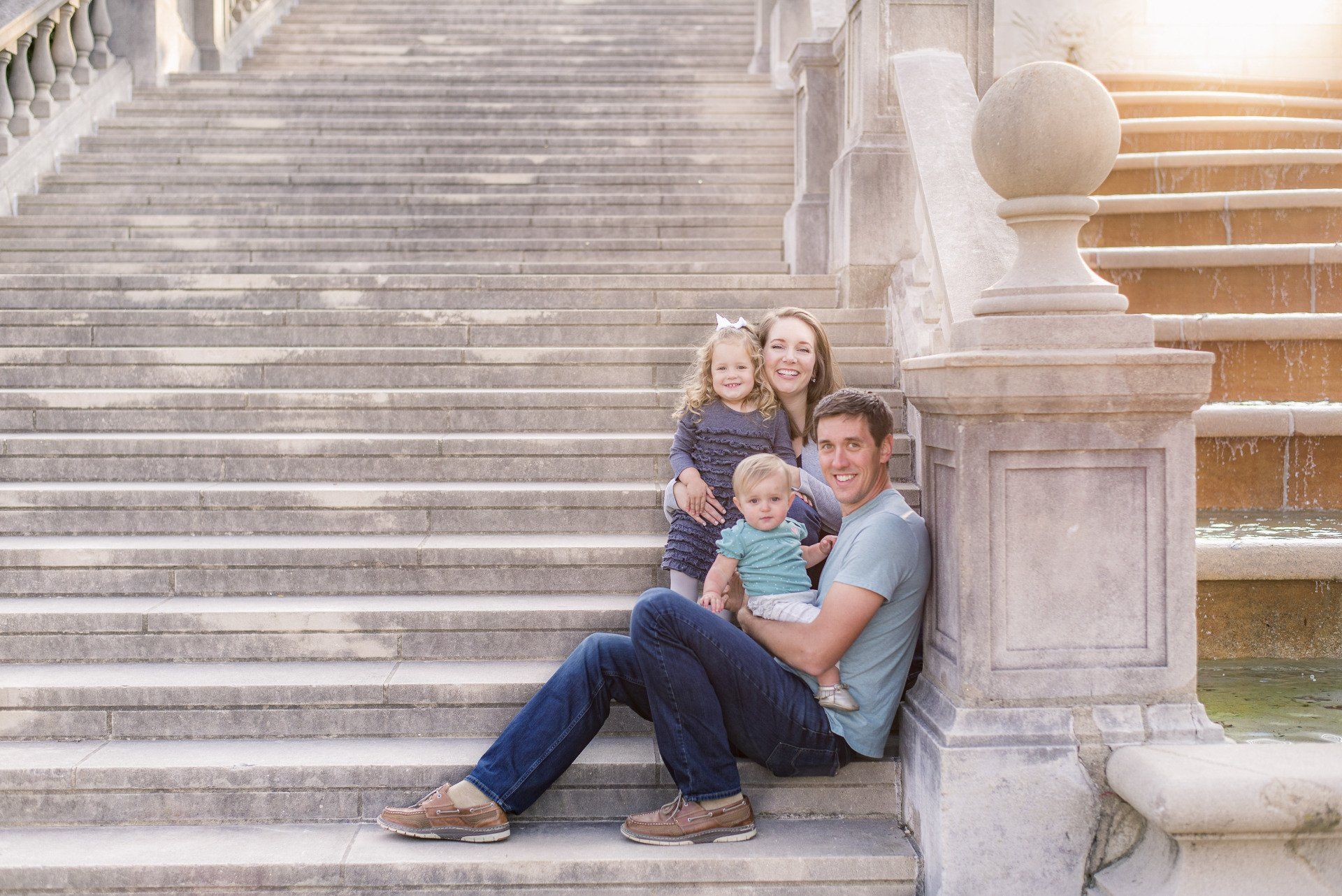Dr. Annie Enzweiler and her family relaxing on steps image