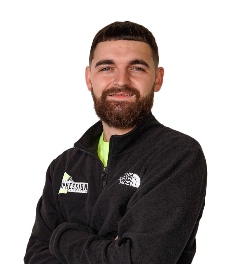 A man with a beard is wearing a north face jacket