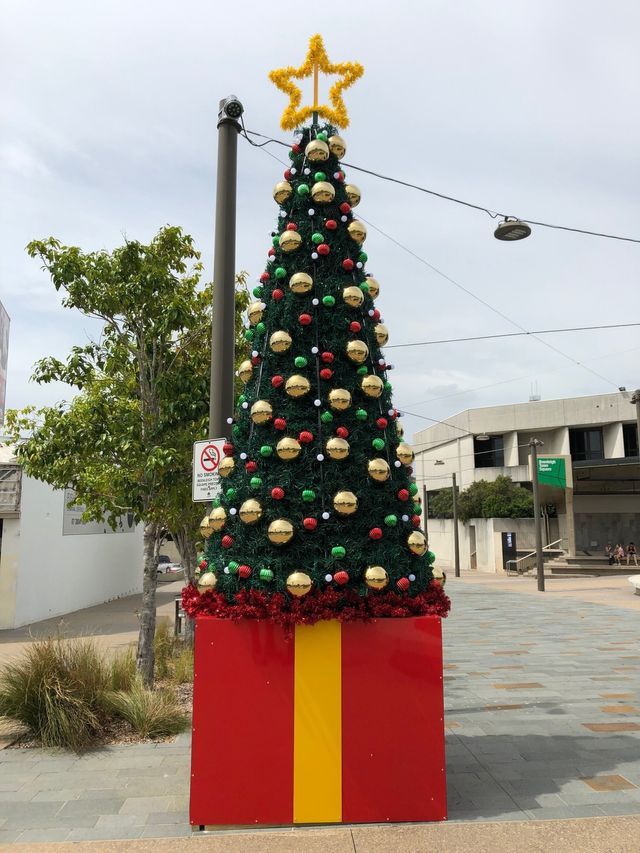 Christmas tree on red present stand
