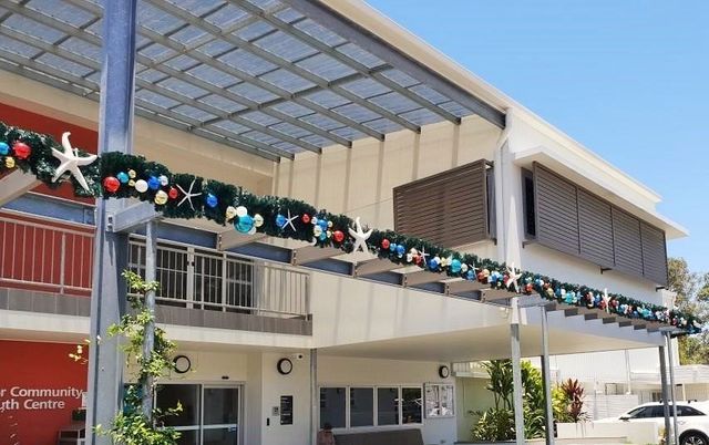 large building with Christmas decor