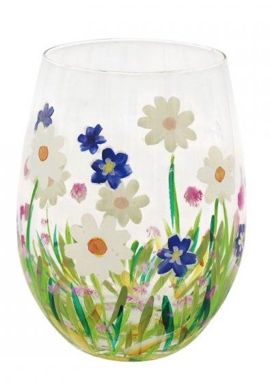 A wine glass with daisies and blue flowers painted on it