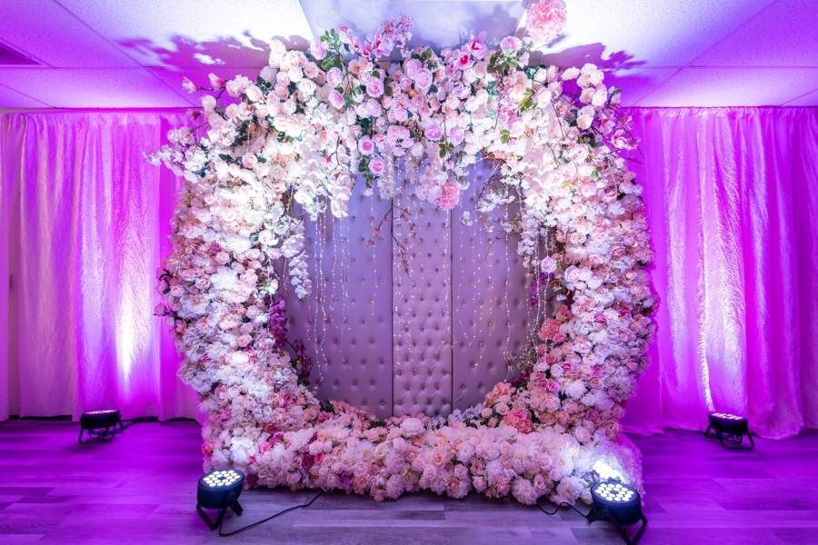 A stack of graduation caps with tassels on a table
