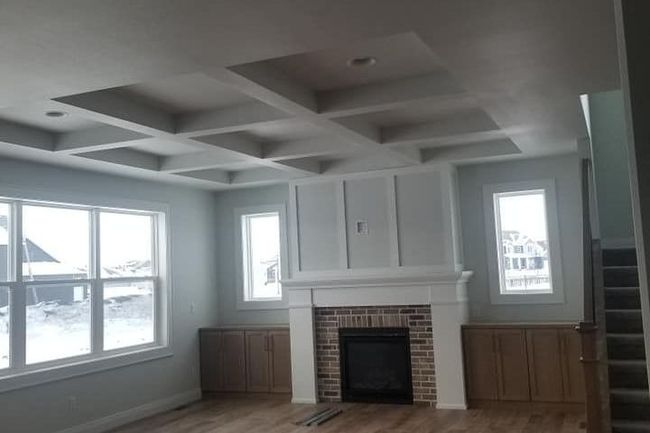 basement with a fireplace and a multi vaulted ceiling accent.