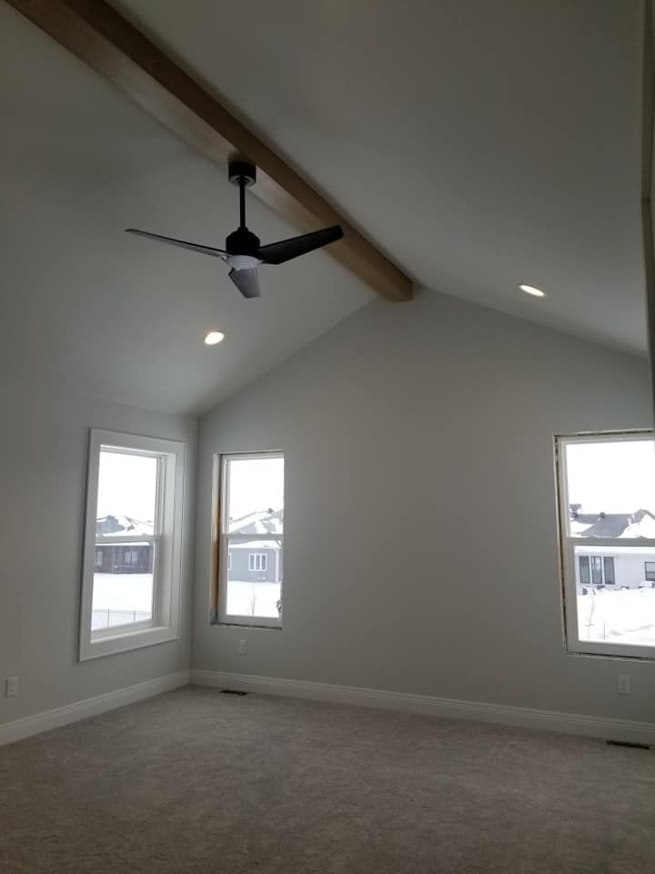 a vaulted ceiling with a finished beam