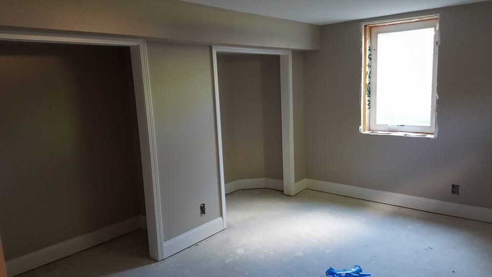 complete drywall and installation with paint in a bedroom with two closets