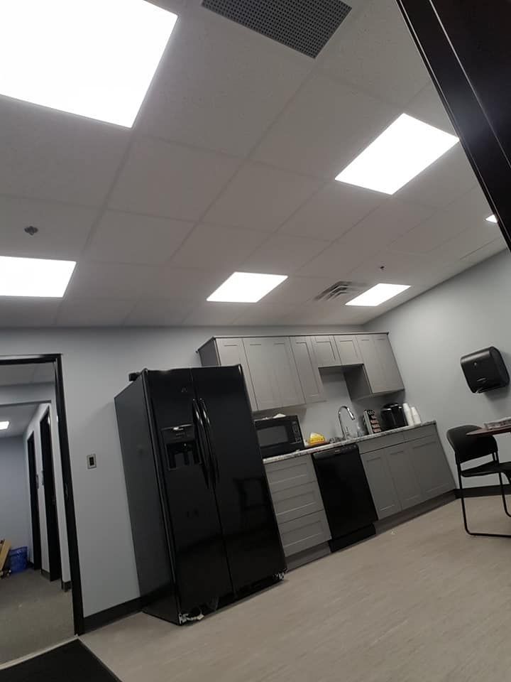A breakroom with anew acoustic ceiling istallation