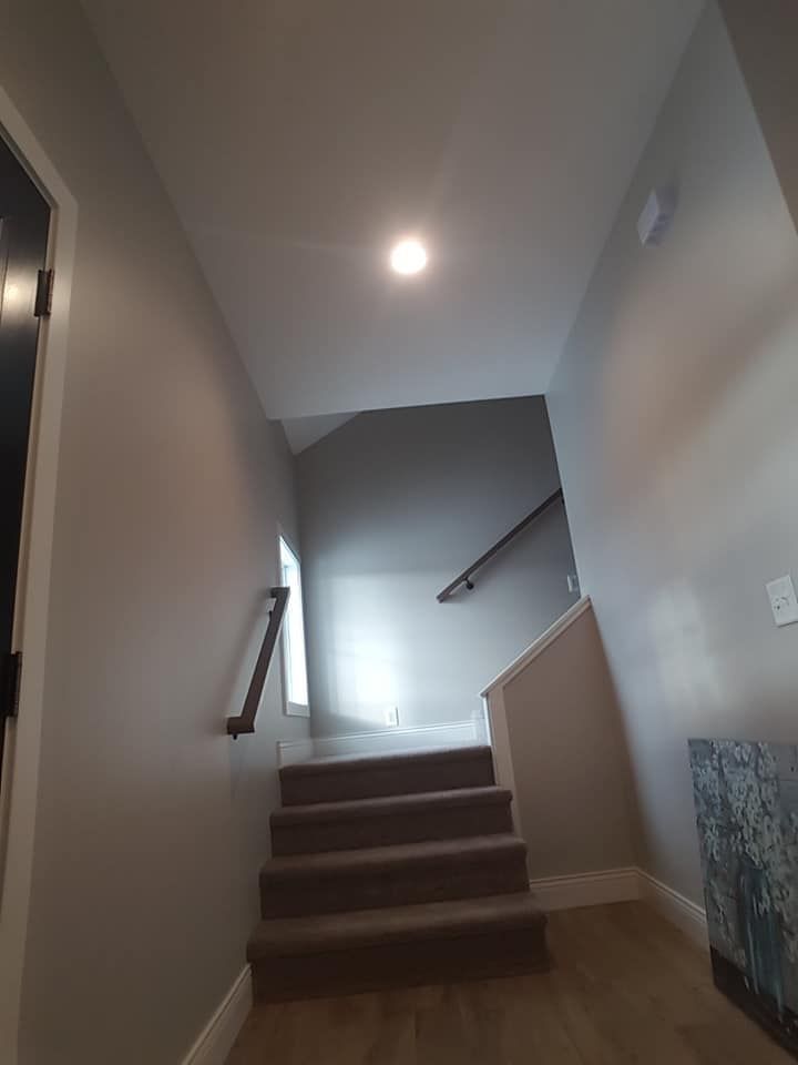 new drywall installation thats finish going up a stairwell