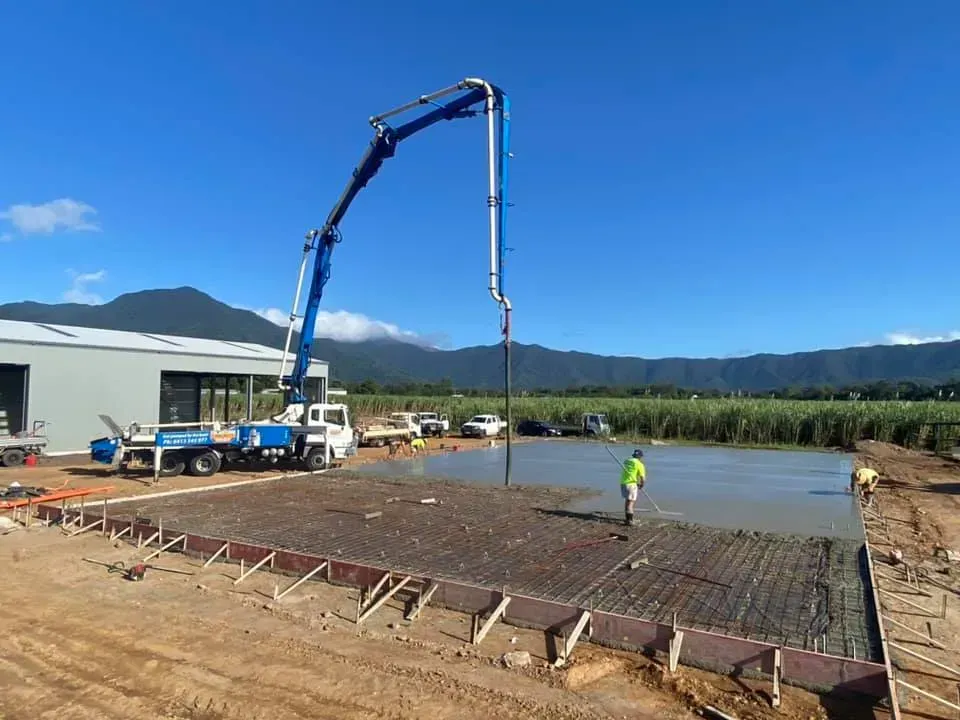 Concrete Being Poured From a Pump Truck Onto a Construction Site — Far Northern Concrete Pumping in Mareeba, QLD